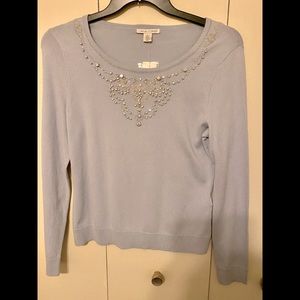 Soft light blue Sweater. New with Tags. Detailed rhinestone design.